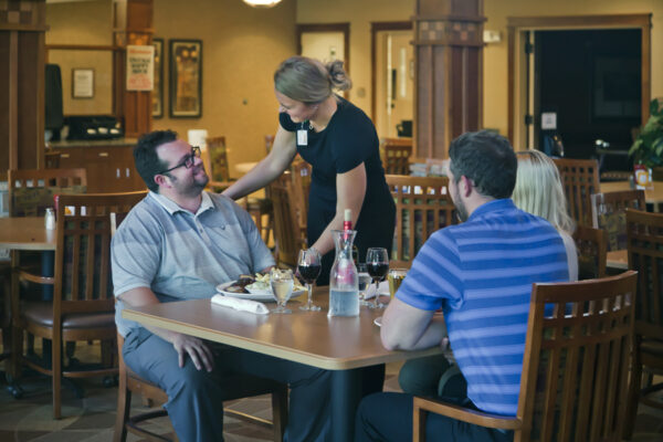 Waitress serving customers Building strong relationships working in a restaurant