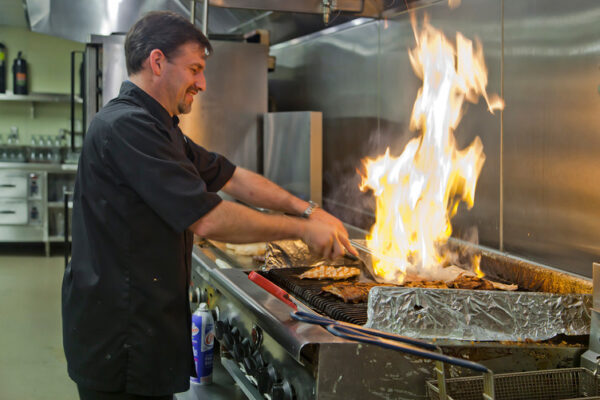 Pioneer Grill staff member in the kitchen working in a restaurant